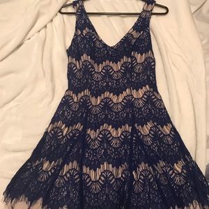 Navy blue and tan lacy dress.